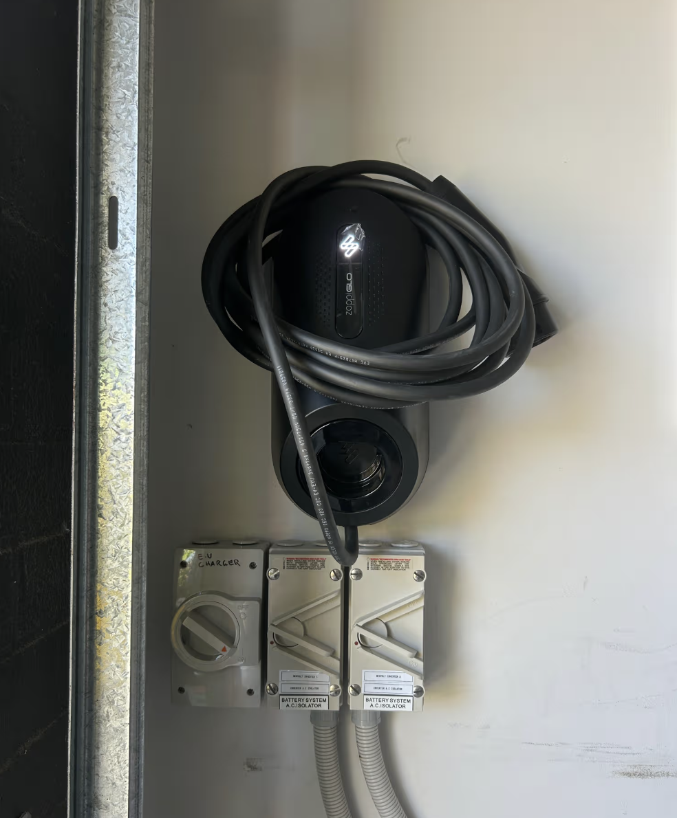 zappi GLO EV charger installed inside garage door in Box Hill, clear of the home battery
